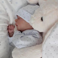 A simulated baby rebirth doll.