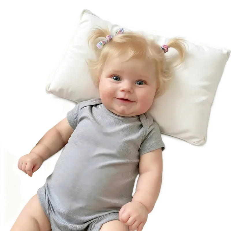 A 20-inch (50 cm) full vinyl reborn baby girl doll named Maddie with rooted blonde hair.